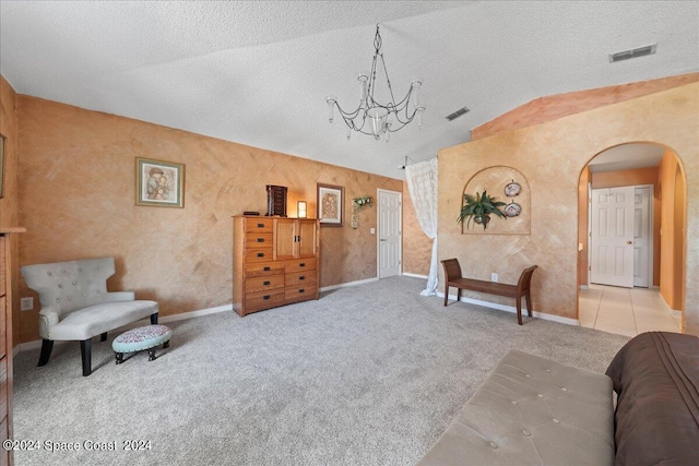 living area featuring light colored carpet, a textured ceiling, and vaulted ceiling