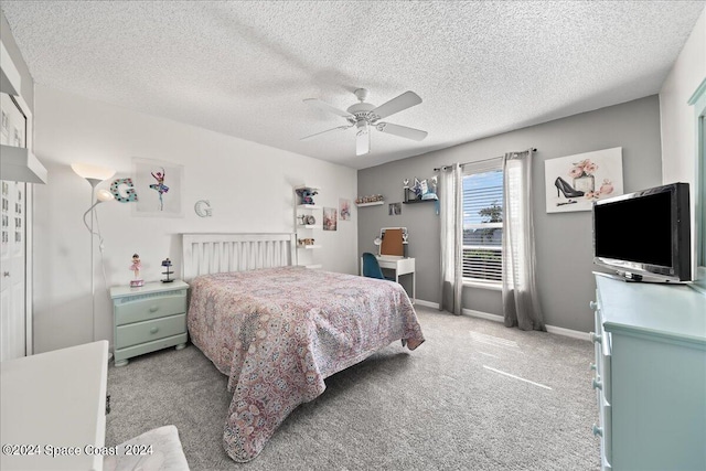 bedroom with a textured ceiling, light carpet, and ceiling fan