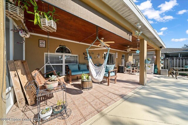 view of patio featuring an outdoor hangout area and ceiling fan