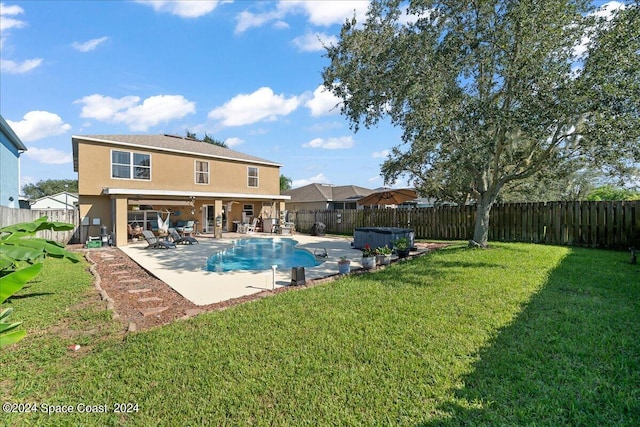 view of pool featuring a patio area and a yard