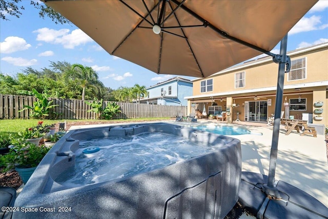 view of pool featuring a patio and a hot tub