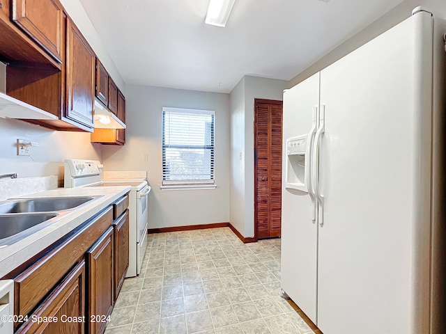 kitchen with sink and white appliances