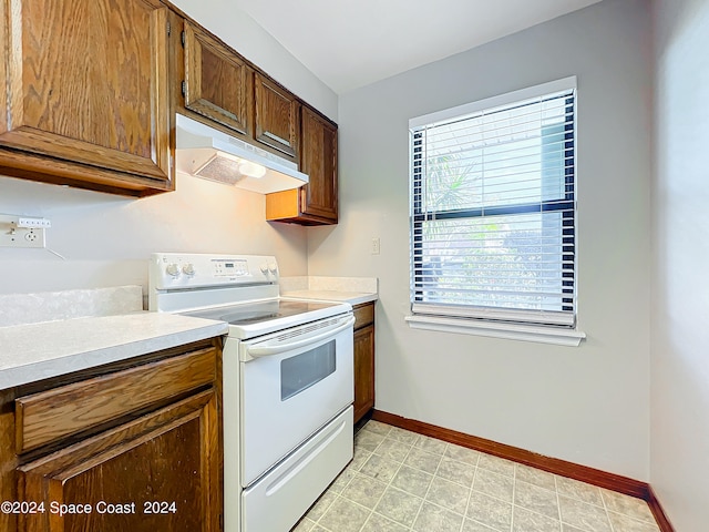 kitchen featuring white electric stove