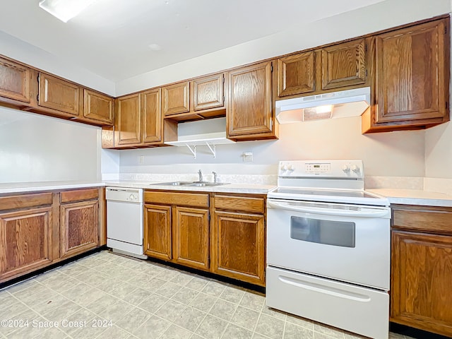 kitchen with sink and white appliances