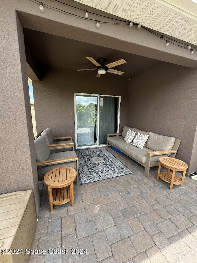 view of patio / terrace featuring an outdoor living space and ceiling fan