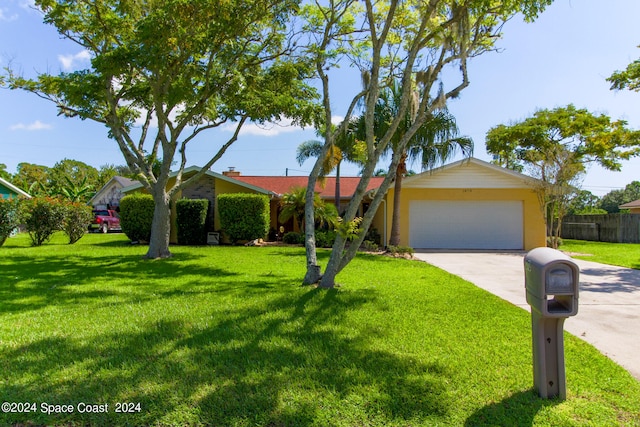 ranch-style home with a front lawn