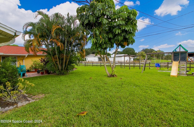 view of yard with a playground