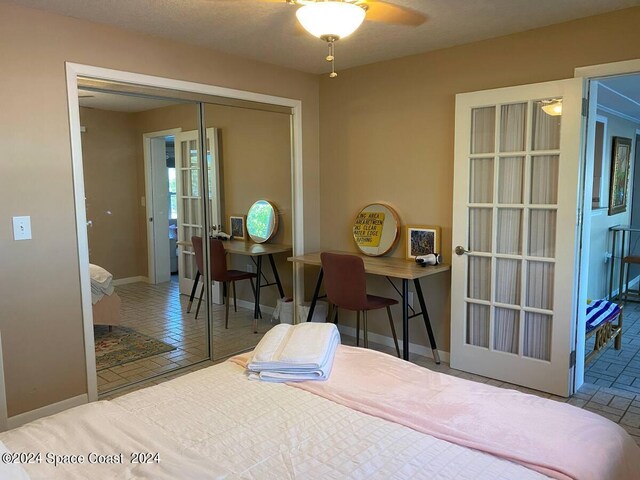 bedroom featuring ceiling fan and a closet