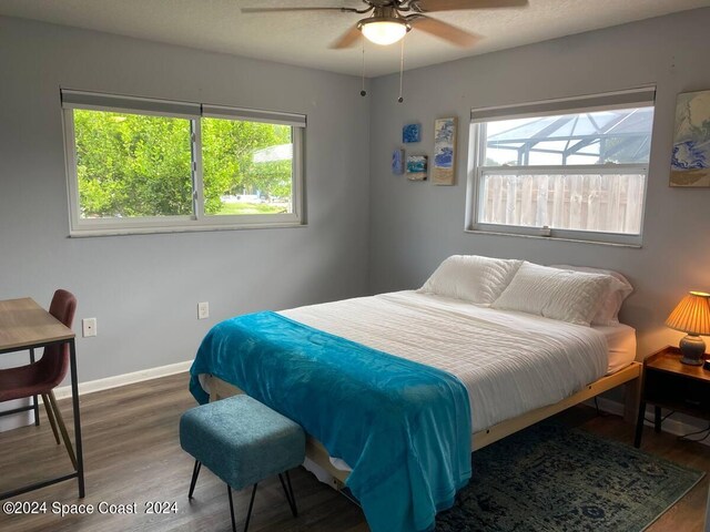 bedroom featuring wood-type flooring and ceiling fan