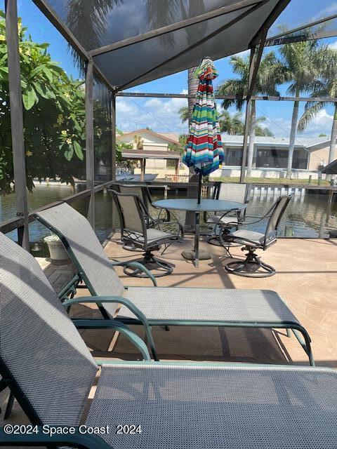 view of patio with a water view