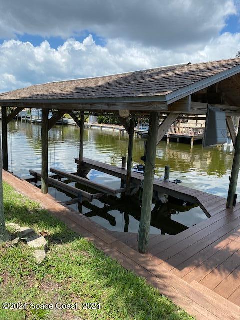 dock area featuring a water view