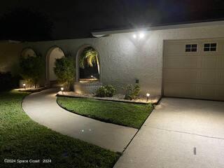 exterior entry at twilight with a garage