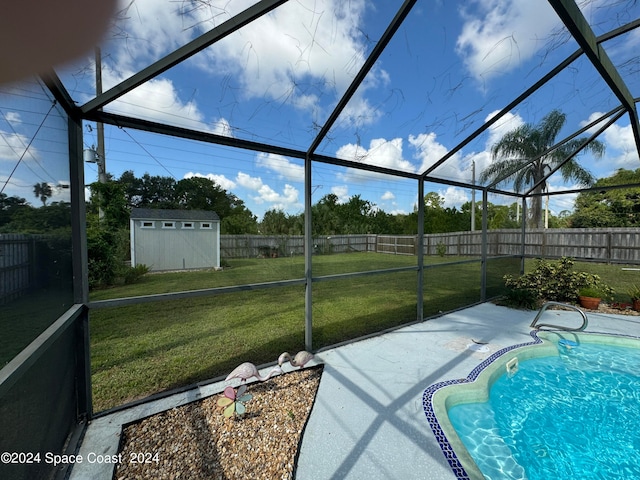 view of swimming pool with a lanai, a storage shed, a yard, and a patio area