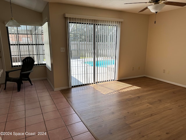 interior space with lofted ceiling, ceiling fan, and hardwood / wood-style flooring