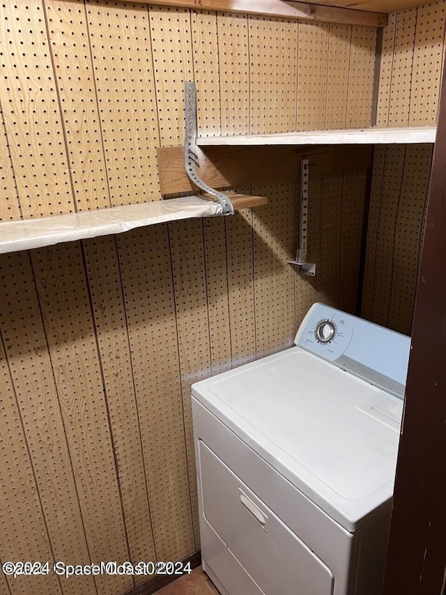 clothes washing area featuring washer / dryer