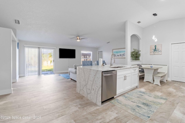 kitchen with ceiling fan, sink, dishwasher, white cabinetry, and lofted ceiling