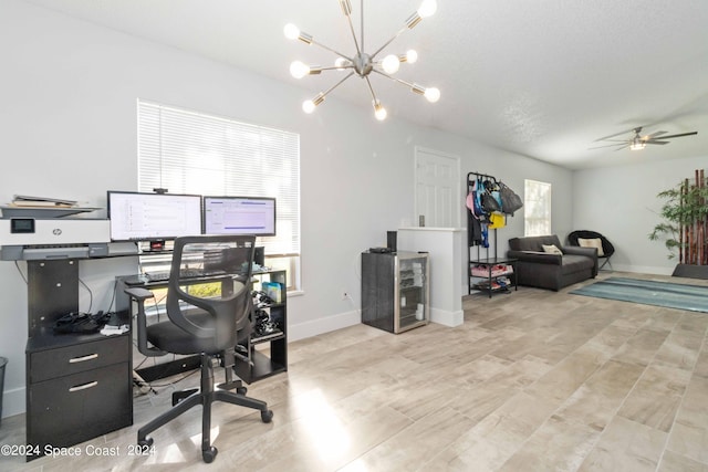 office with a textured ceiling and ceiling fan with notable chandelier