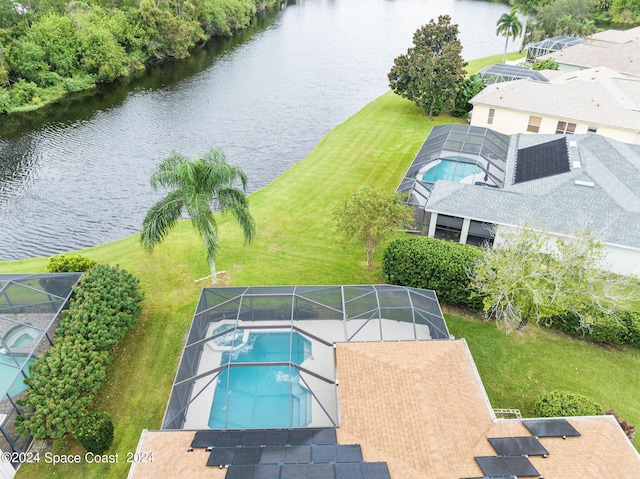 birds eye view of property with a water view