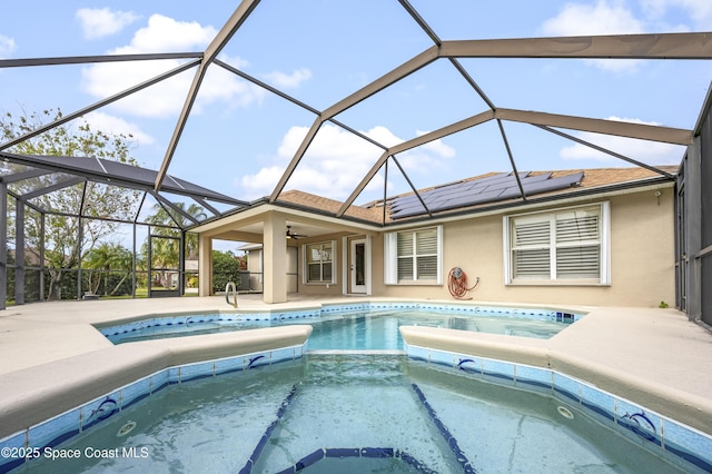 view of pool featuring glass enclosure and a patio area