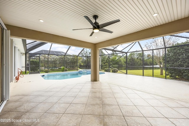 view of swimming pool featuring a patio and a lanai