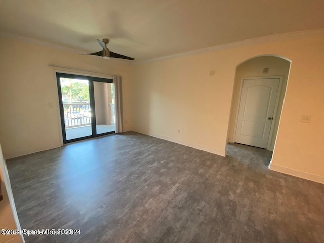 empty room with ceiling fan, dark hardwood / wood-style floors, and ornamental molding