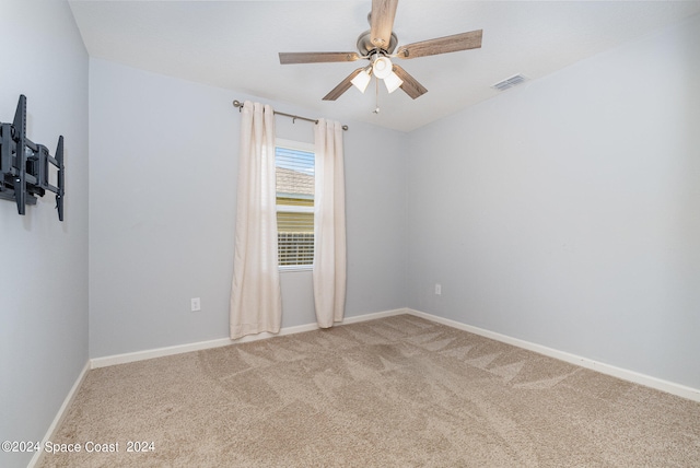 empty room with carpet flooring and ceiling fan