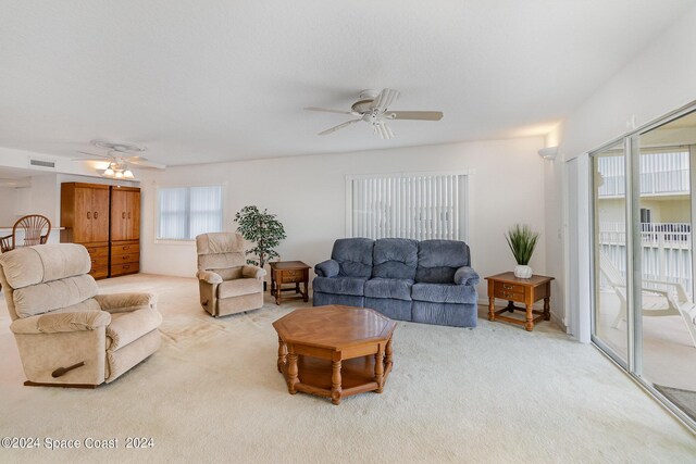 living room with carpet and ceiling fan