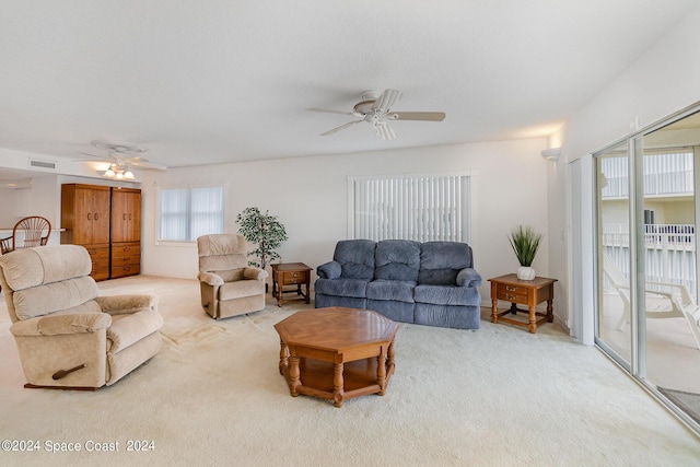 8931 Lake Dr Unit 401, Cape Canaveral, FL 32920 - carpeted living area featuring visible vents and ceiling fan