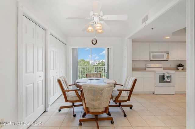 dining area with ceiling fan and light tile patterned floors