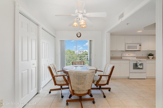 8931 Lake Dr Unit 401, Cape Canaveral, FL 32920 - dining room featuring ceiling fan, visible vents, and light tile patterned floors