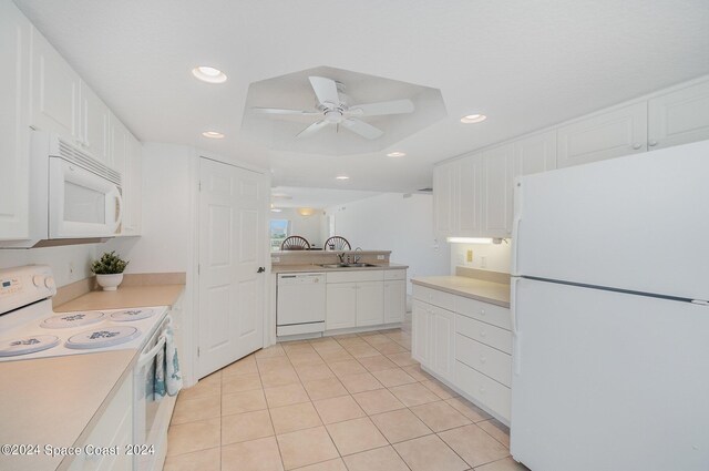 kitchen featuring sink, white cabinetry, white appliances, light tile patterned floors, and ceiling fan