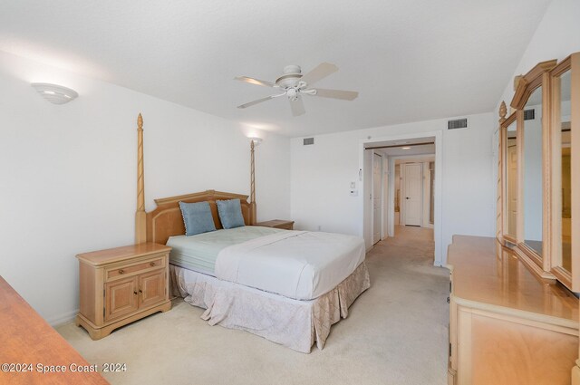 bedroom featuring ceiling fan and light carpet