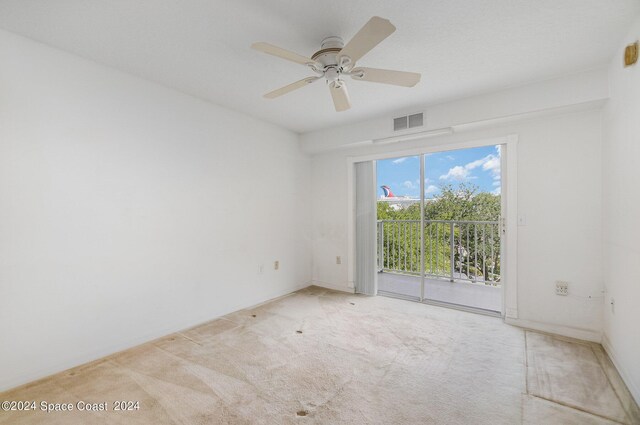 carpeted empty room with ceiling fan