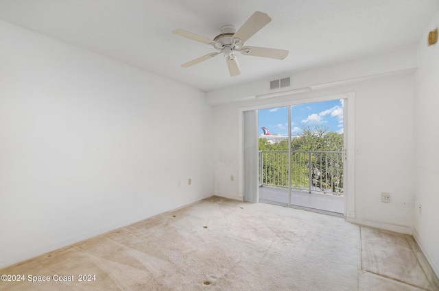 8931 Lake Dr Unit 401, Cape Canaveral, FL 32920 - carpeted empty room featuring baseboards, visible vents, and a ceiling fan