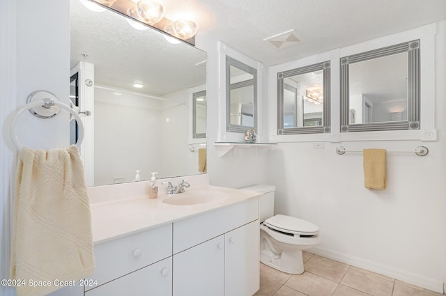 8931 Lake Dr Unit 401, Cape Canaveral, FL 32920 - bathroom featuring tile patterned flooring, vanity, toilet, a textured ceiling, and walk in shower