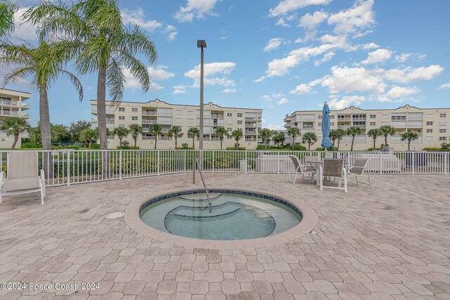 view of pool featuring a community hot tub