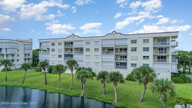 view of building exterior with a water view