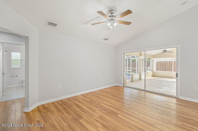 empty room with light wood-type flooring, a healthy amount of sunlight, and ceiling fan