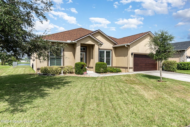 single story home featuring a front yard and a garage