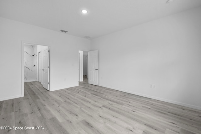 unfurnished bedroom featuring baseboards, recessed lighting, light wood finished floors, and visible vents