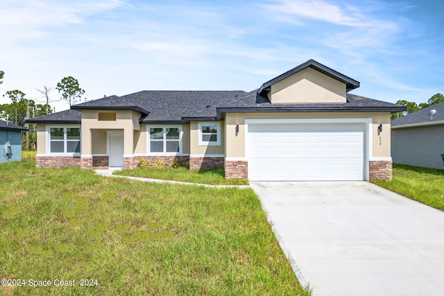 prairie-style home featuring stone siding, concrete driveway, stucco siding, and a garage