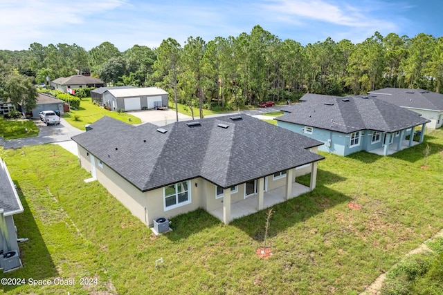aerial view featuring a wooded view and a residential view