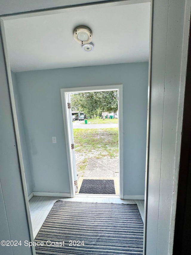 doorway with light hardwood / wood-style floors