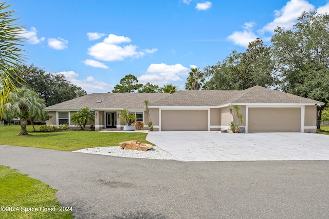 single story home featuring a front yard and a garage