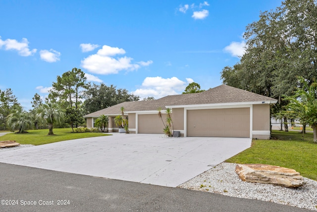 ranch-style home with a front yard and a garage