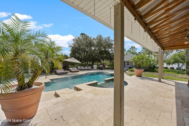 view of swimming pool featuring a patio area