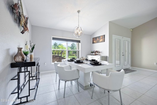 dining area with a notable chandelier, vaulted ceiling, and light tile patterned floors