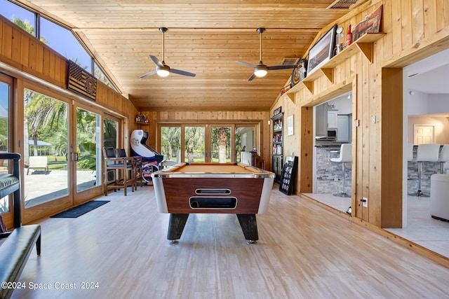 playroom with ceiling fan, wood walls, french doors, billiards, and light hardwood / wood-style floors