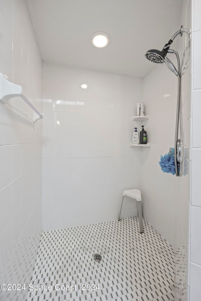 bathroom with tiled shower