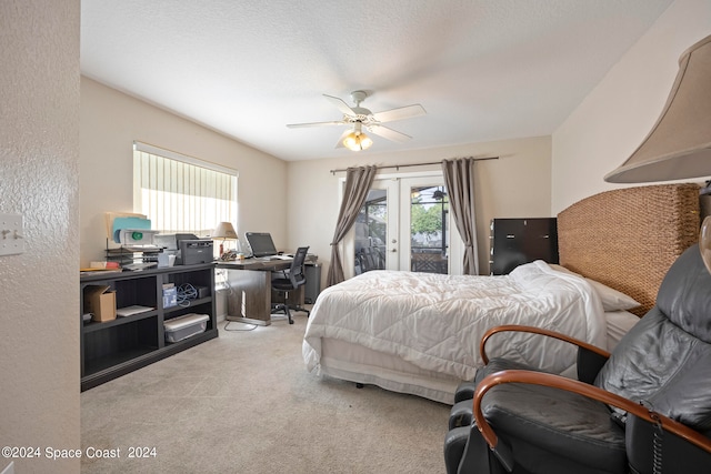 bedroom featuring light carpet, ceiling fan, access to outside, and french doors